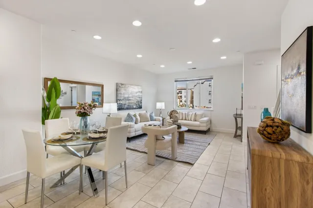 a living room with furniture and a table