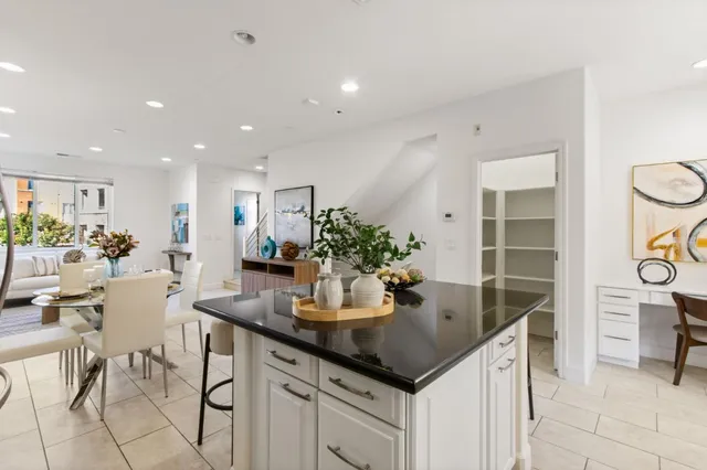 a kitchen with a table and chairs in it