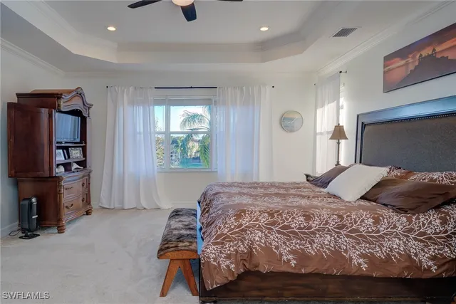 a bedroom with a bed and a television