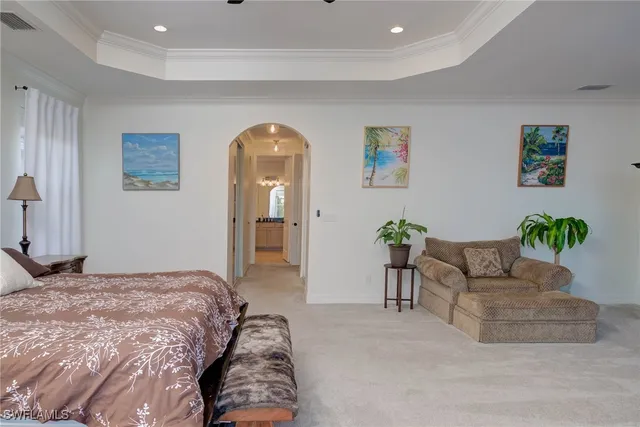 a bedroom with a bed and a couch