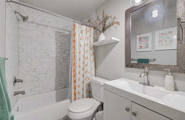 a bathroom with a sink a toilet and a bathtub