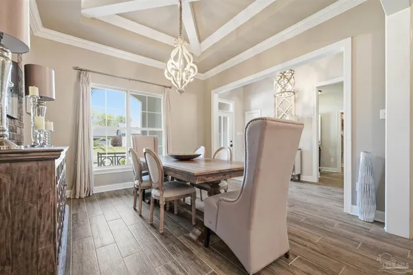 a living room with furniture a fireplace and a ceiling fan