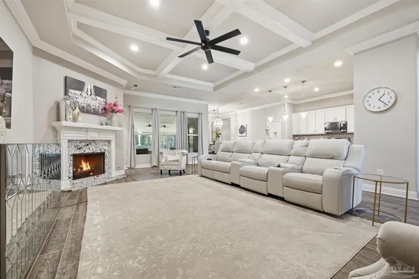 a living room with furniture and kitchen view