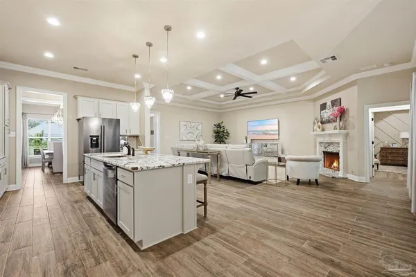 a large bathroom with a granite countertop double vanity sink a mirror and a shower