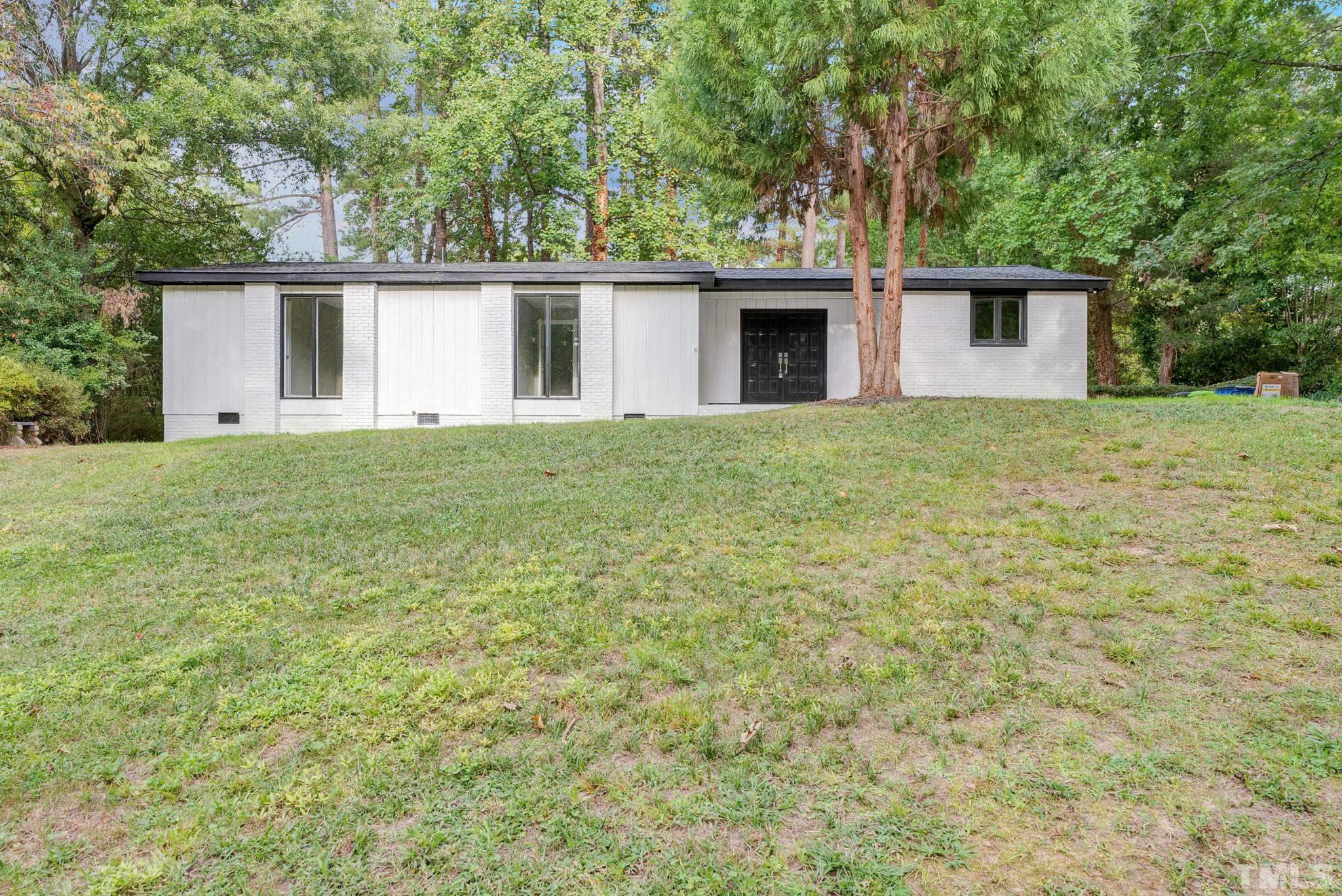 6712 Millbridge Court Raleigh, NC 27615 - Photo 1 of 25 front view of a house with a yard