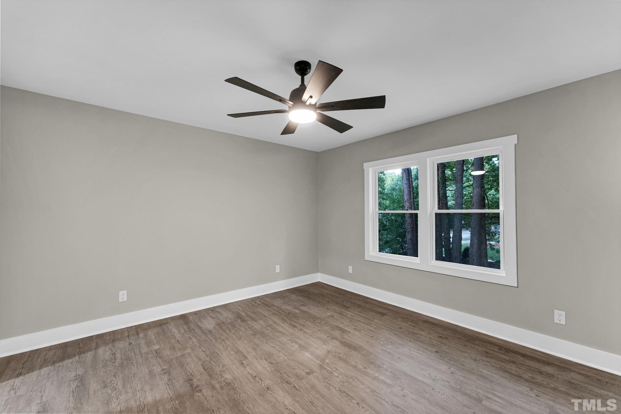 6712 Millbridge Court Raleigh, NC 27615 - Photo 16 of 25 a view of an empty room with a window