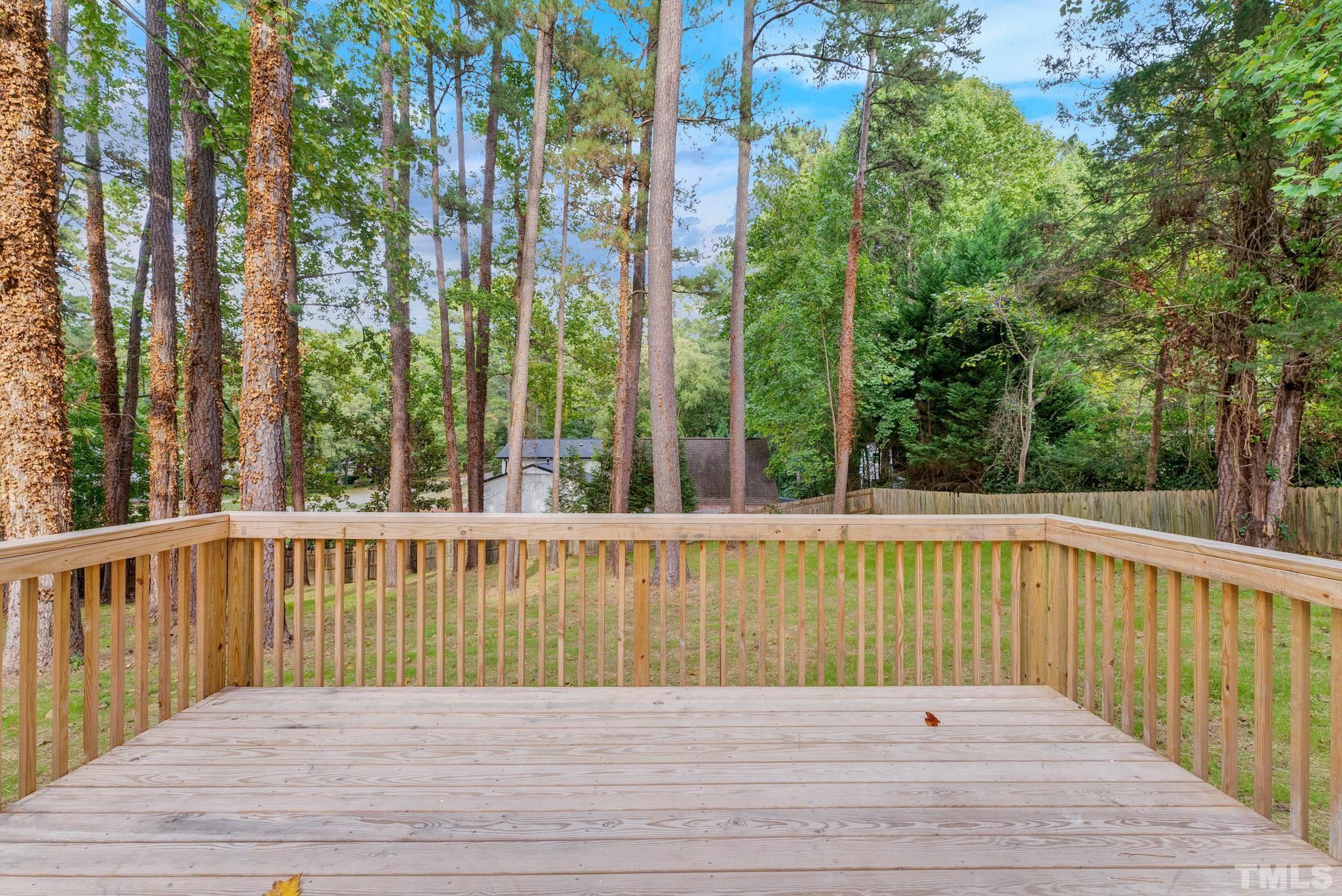 6712 Millbridge Court Raleigh, NC 27615 - Photo 22 of 25 a view of balcony with wooden floor and fence