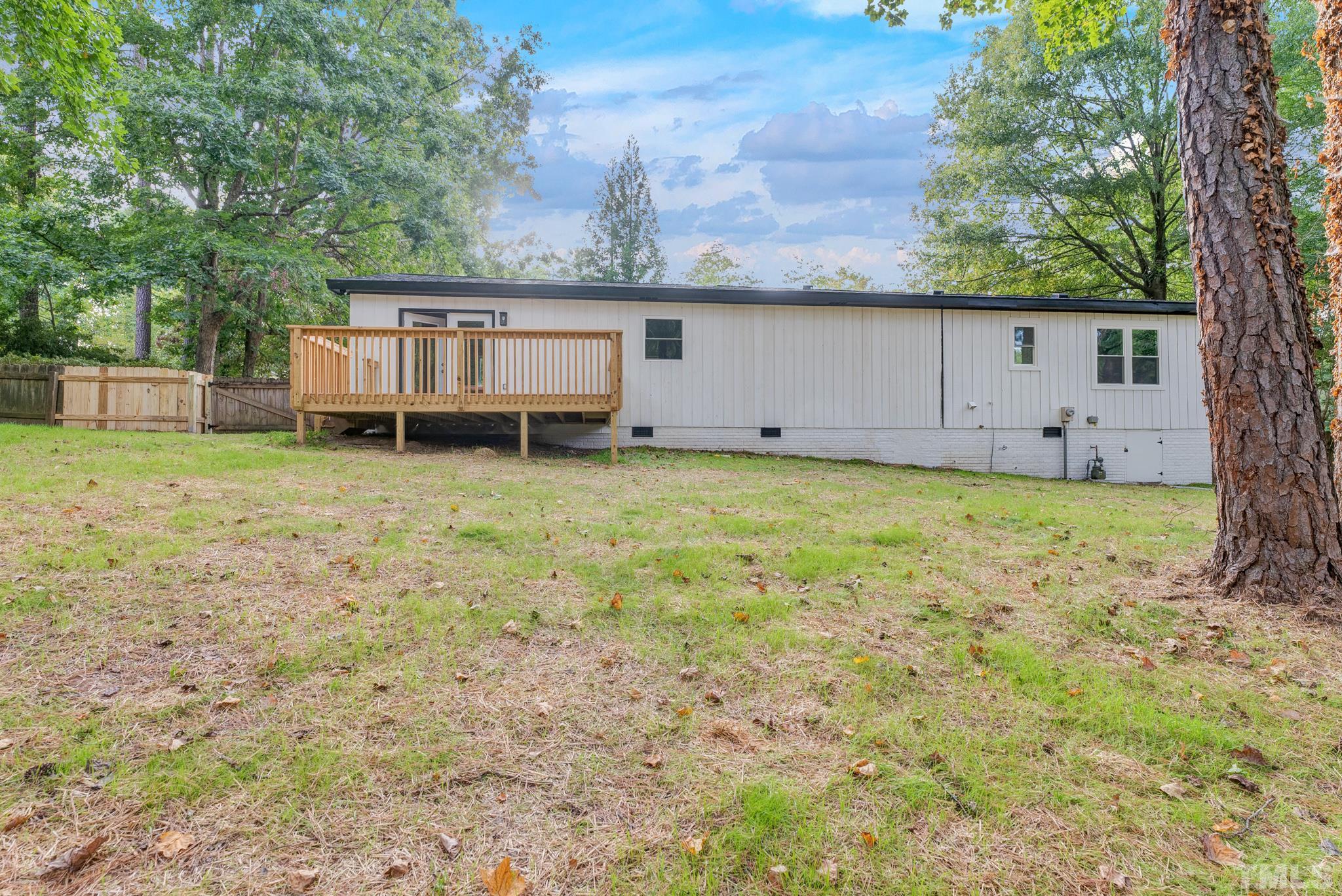 6712 Millbridge Court Raleigh, NC 27615 - Photo 25 of 25 a view of a house with a backyard