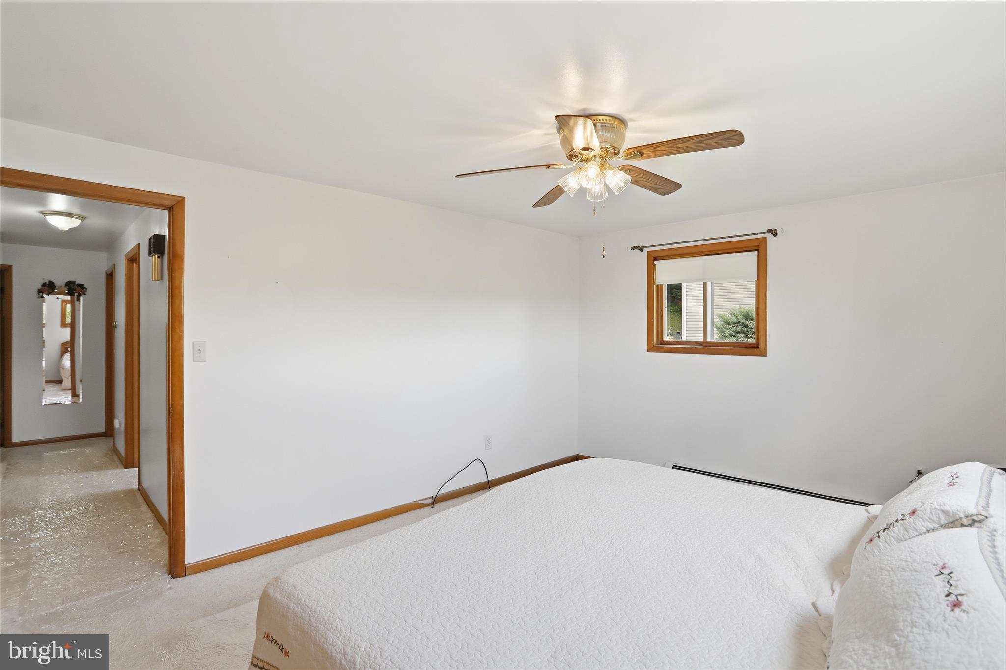 199 Buser Street Ridgeley, WV 26753 - Photo 22 of 49 a bedroom with a bed and a chandelier