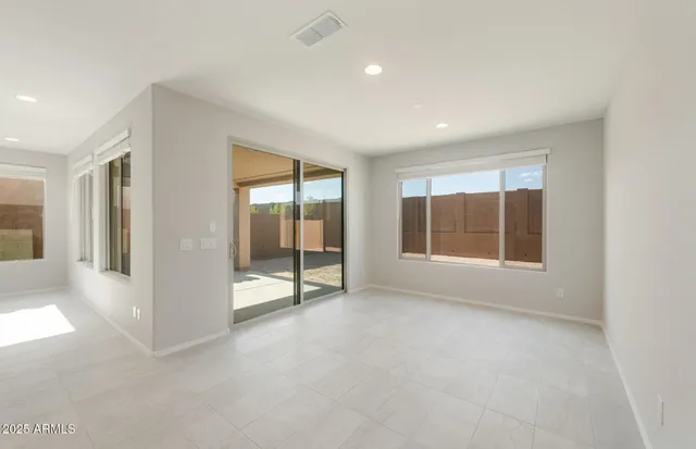 a kitchen with granite countertop kitchen island a sink and a stove top oven