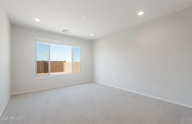 a large living room with a large window in a kitchen
