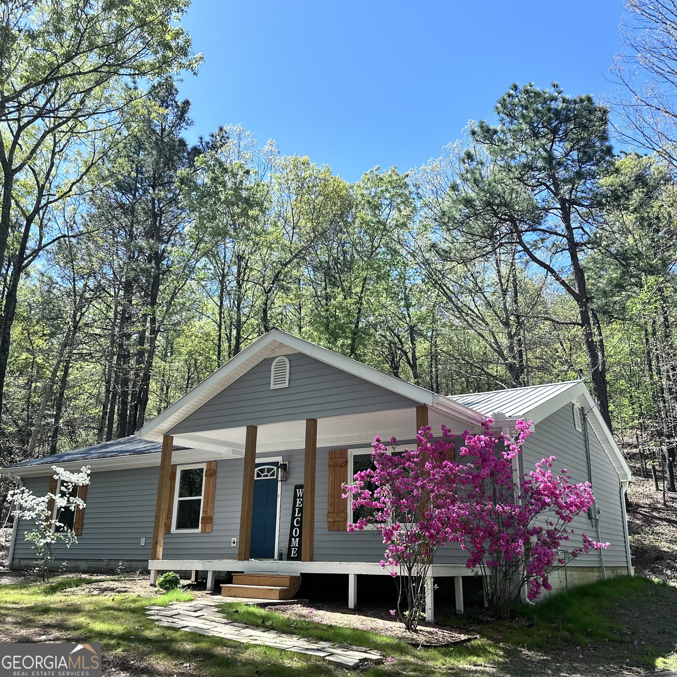 1348 Pleasant Valley Road Molena, GA 30258 - Photo 1 of 1 a front view of a house with garden