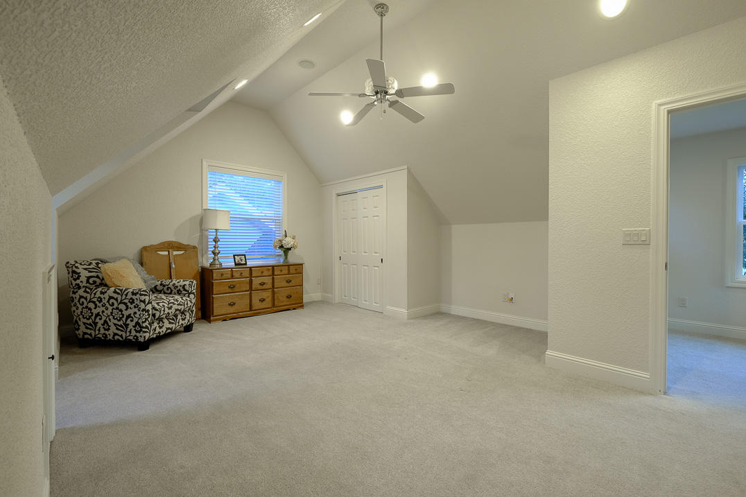 375 Hamilton Road Jacksonville, OR 97530 - Photo 27 of 47 a big room with chandelier fan and windows
