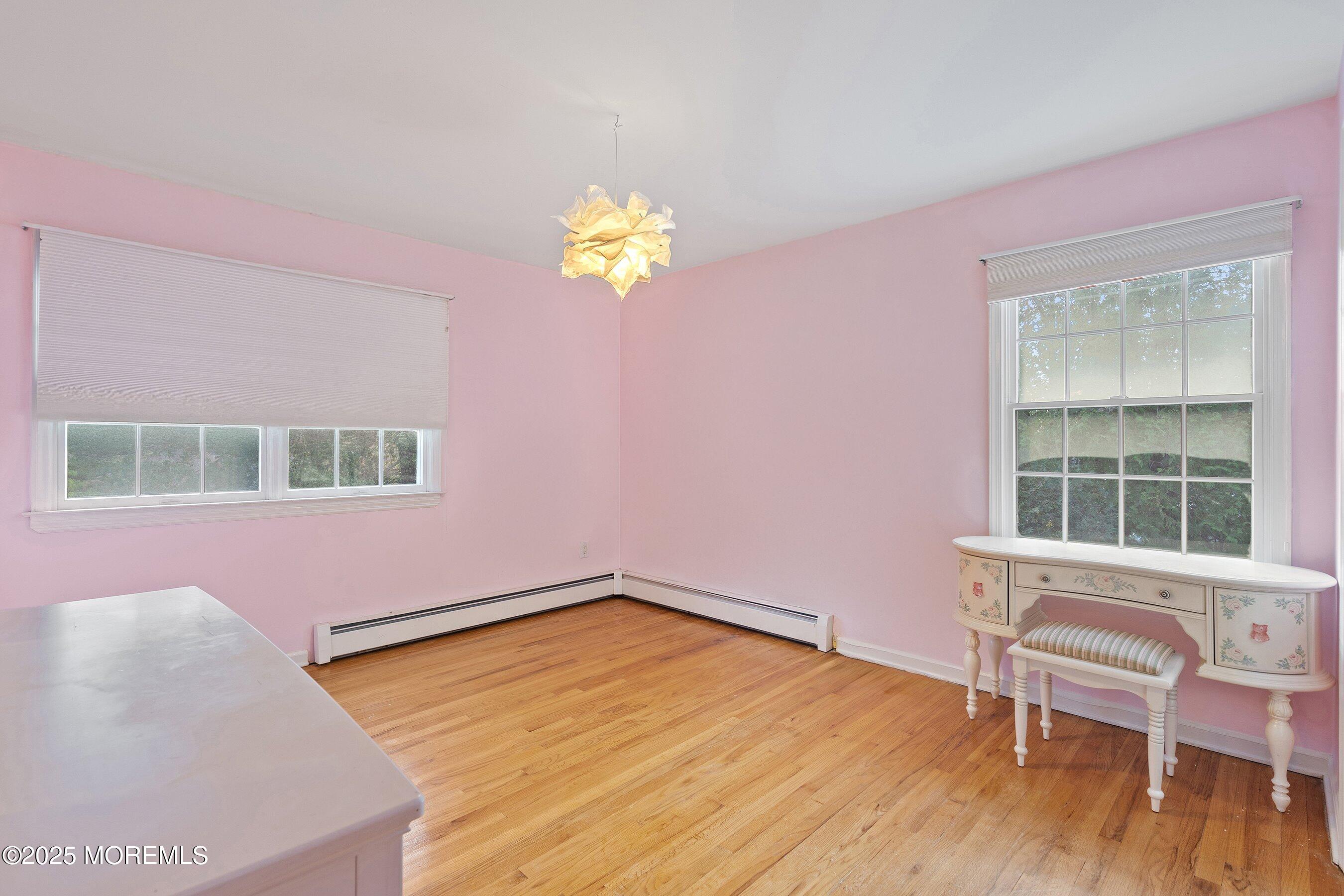 677 Overlook Court Brick, NJ 08724 - Photo 16 of 26 a view of a room with wooden floor and a window