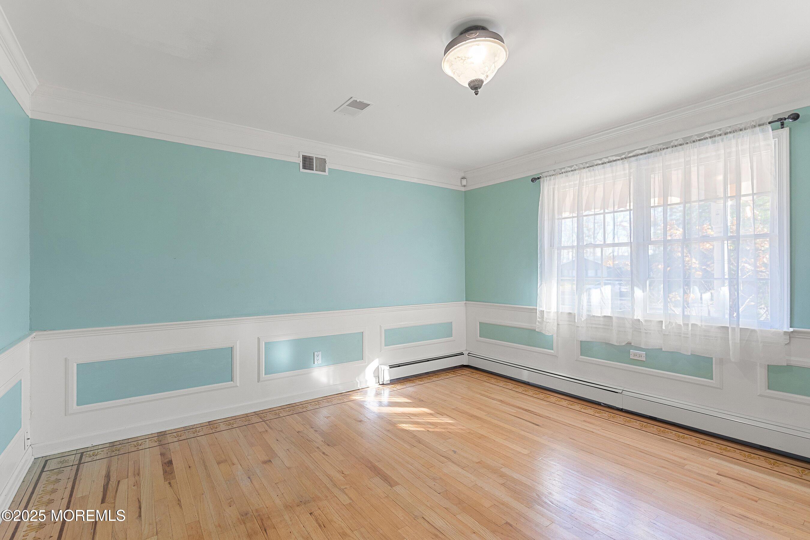 677 Overlook Court Brick, NJ 08724 - Photo 2 of 26 a view of room with window and wooden floor