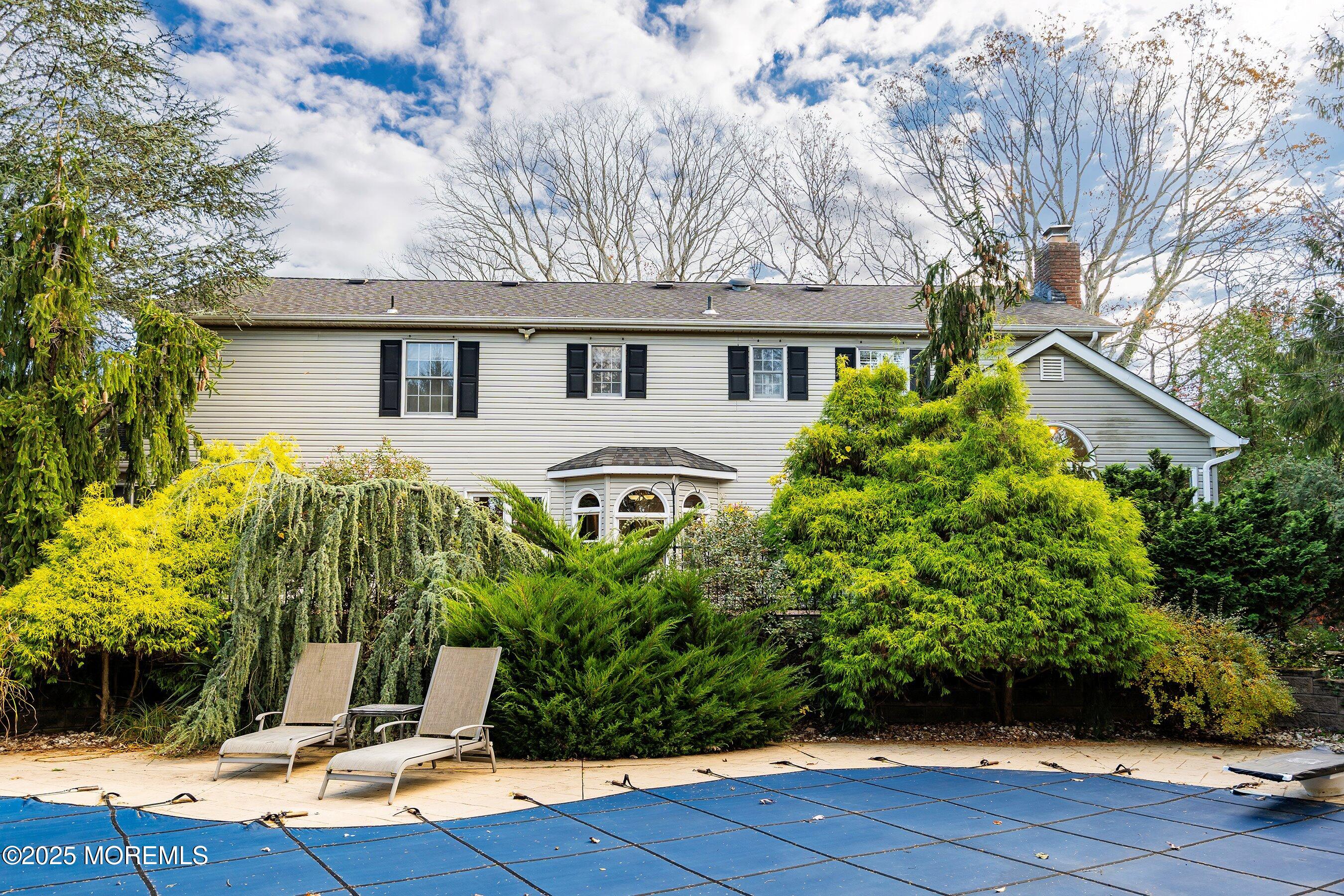 677 Overlook Court Brick, NJ 08724 - Photo 22 of 26 a front view of a house with garden