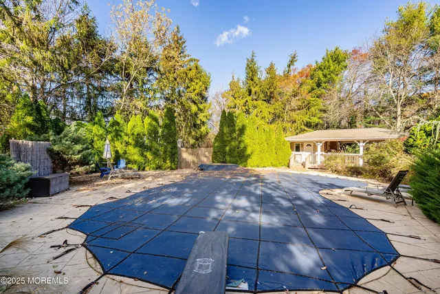 a front view of a house with a yard and a garden