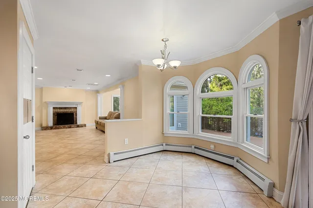 a view of a kitchen with a sink and a fireplace in it