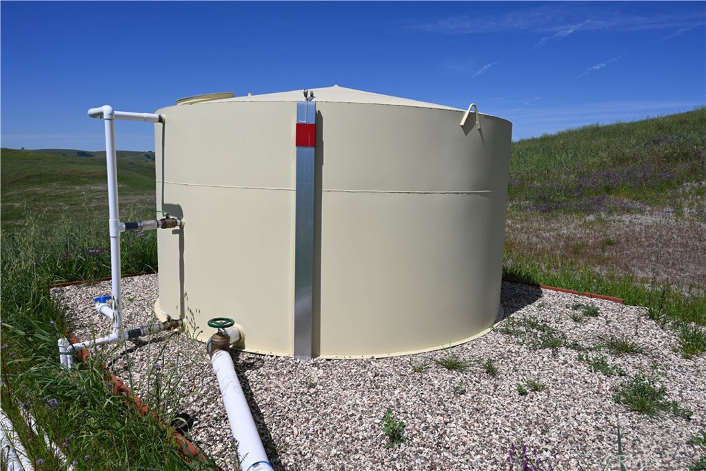 77505 Reinert Road San Miguel, CA 93451 - Photo 22 of 29 a white house with tree in front of it