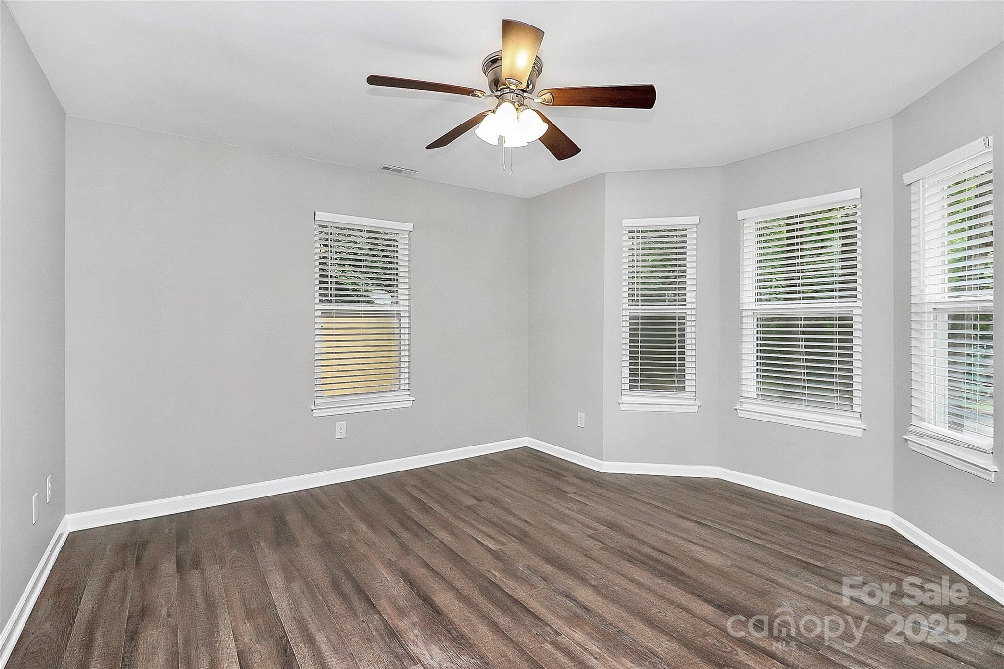 1540 Nichole Lane Fort Mill, SC 29708 - Photo 20 of 33 a view of an empty room with wooden floor and a window
