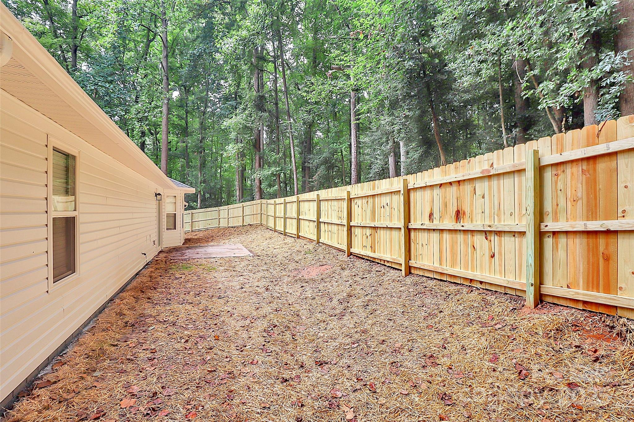 1540 Nichole Lane Fort Mill, SC 29708 - Photo 30 of 33 a view of a backyard with large trees