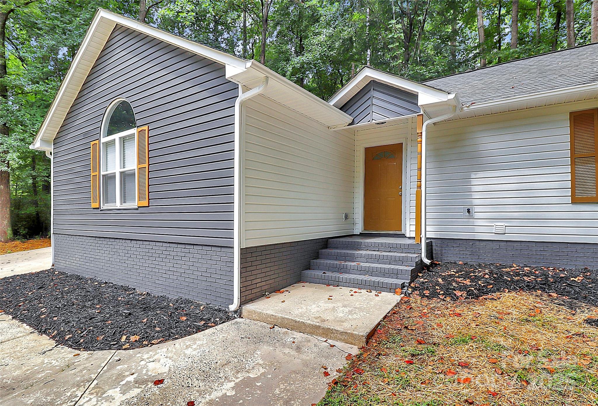 1540 Nichole Lane Fort Mill, SC 29708 - Photo 3 of 33 a view of a house with a yard and garage