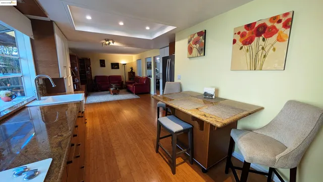 a view of a livingroom with furniture and wooden floor