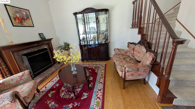 a living room with furniture fireplace and flat screen tv