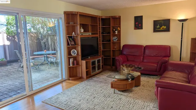 a living room with furniture and a gate