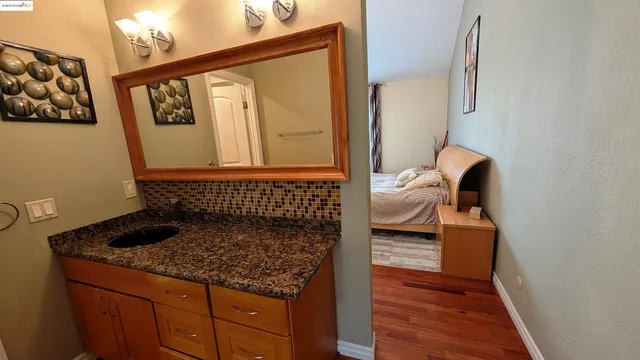 a bathroom with a bathtub and a mirror