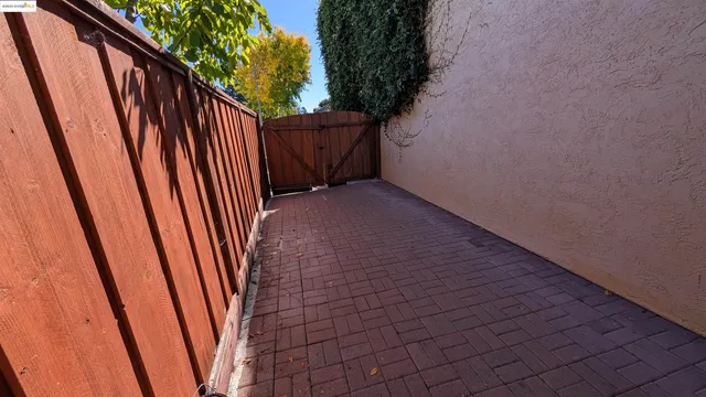 a view of a pathway with a garden