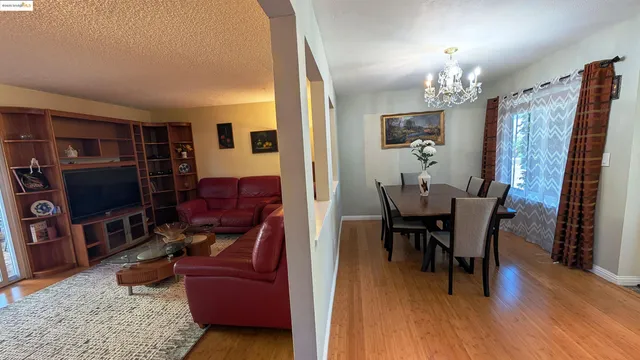 a view of a livingroom with furniture and a flat screen tv