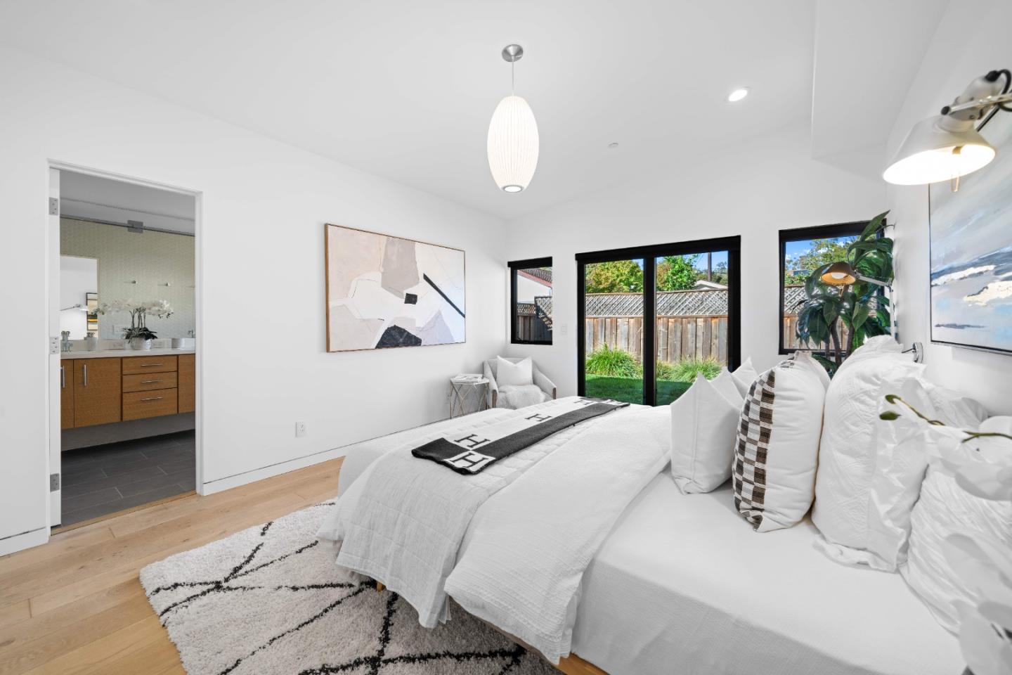 359 Stowell Avenue Sunnyvale, CA 94085 - Photo 20 of 53 a bedroom with bed and a large window