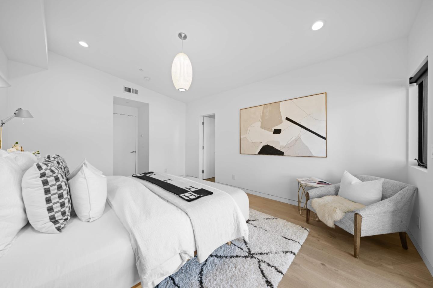 359 Stowell Avenue Sunnyvale, CA 94085 - Photo 22 of 53 a bedroom with a bed and wooden floor