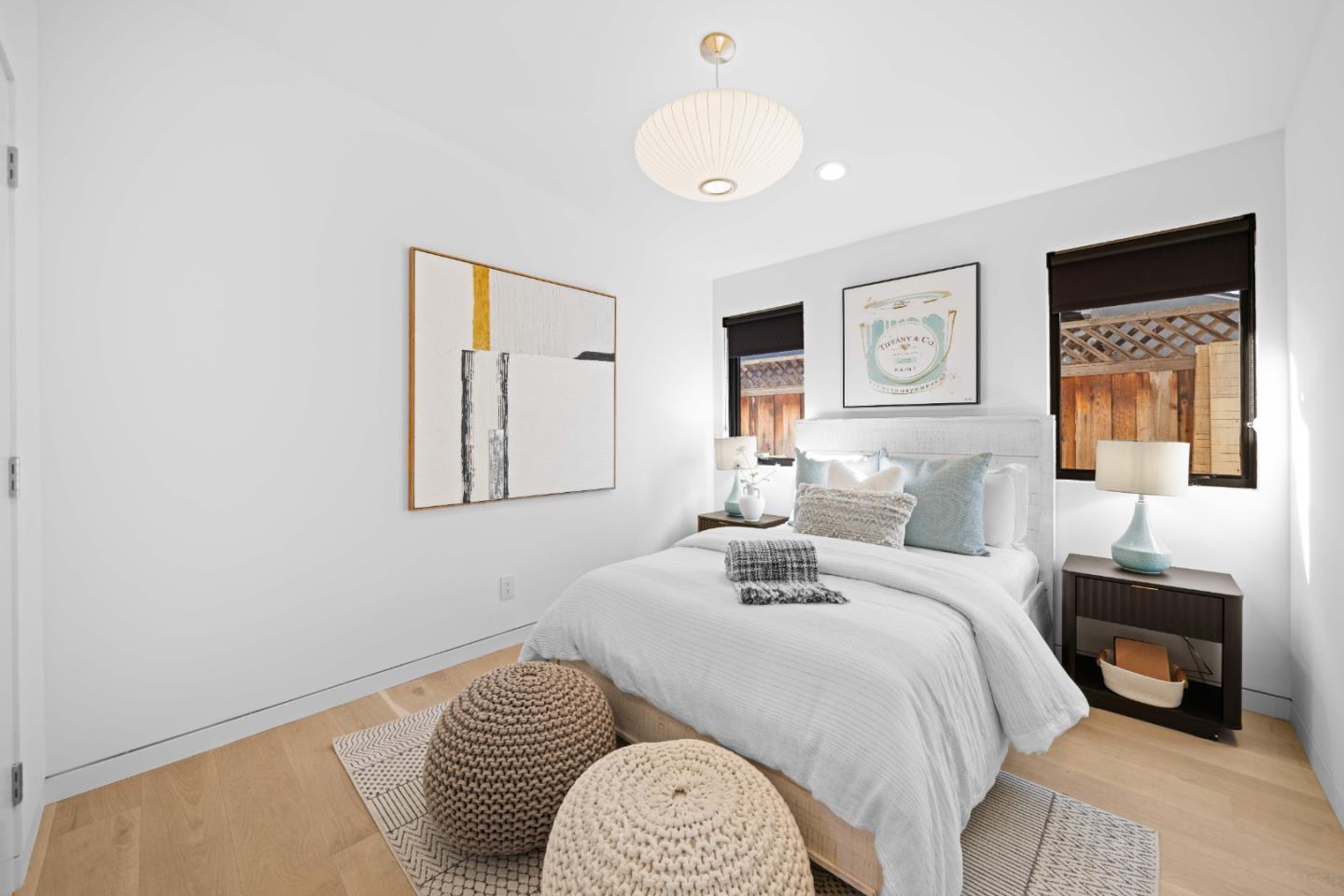 359 Stowell Avenue Sunnyvale, CA 94085 - Photo 28 of 53 a bedroom with a bed and a chandelier