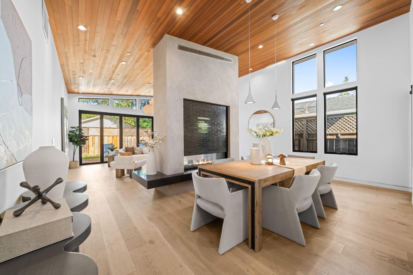 359 Stowell Avenue Sunnyvale, CA 94085 - Photo 10 of 53 a living room with fireplace furniture and a large window