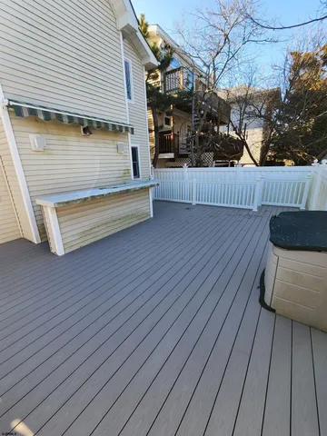 a view of outdoor space with deck and living room