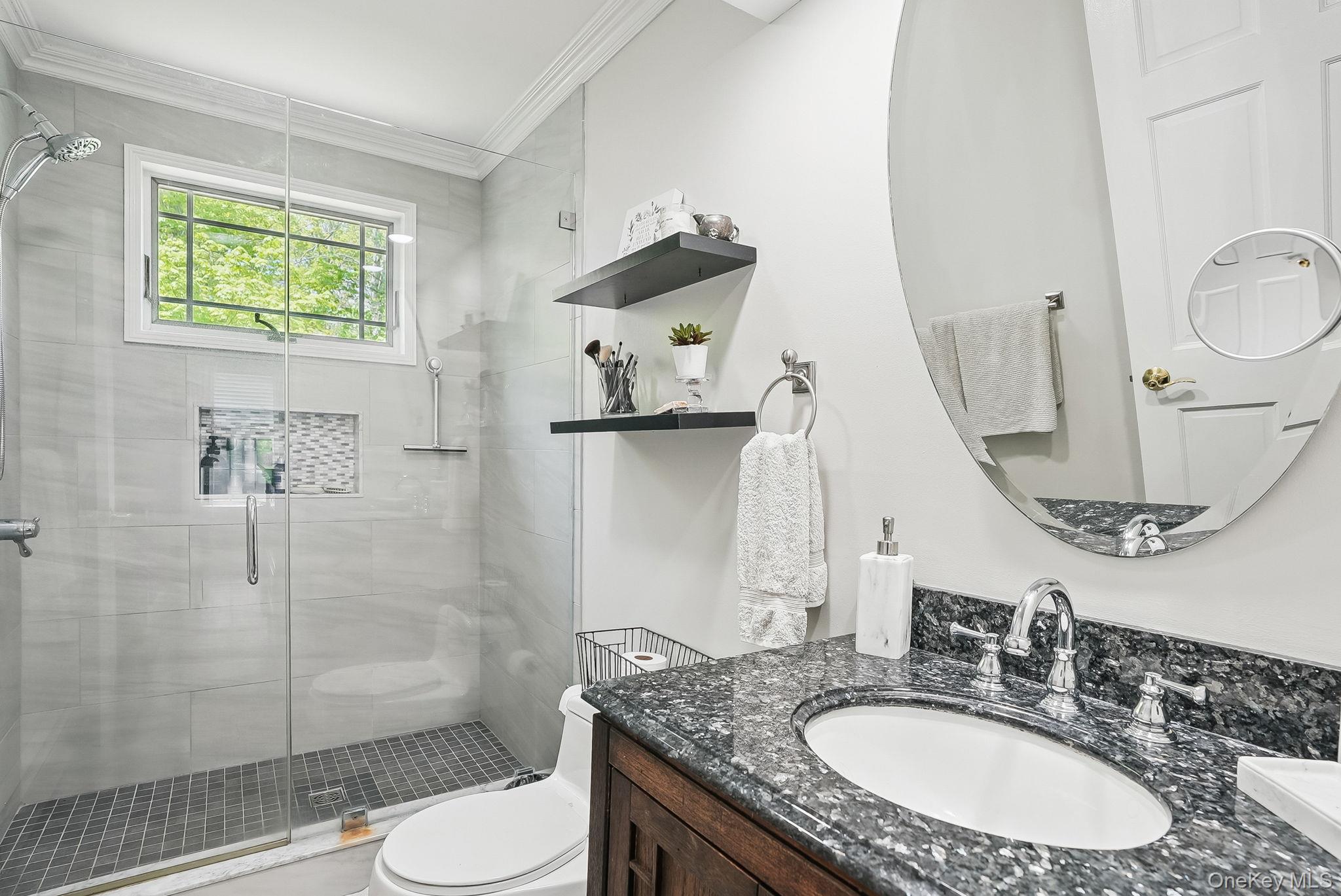 304 Church Road Putnam Valley, NY 10579 - Photo 22 of 50 Bathroom with crown molding, a stall shower, toilet, and vanity