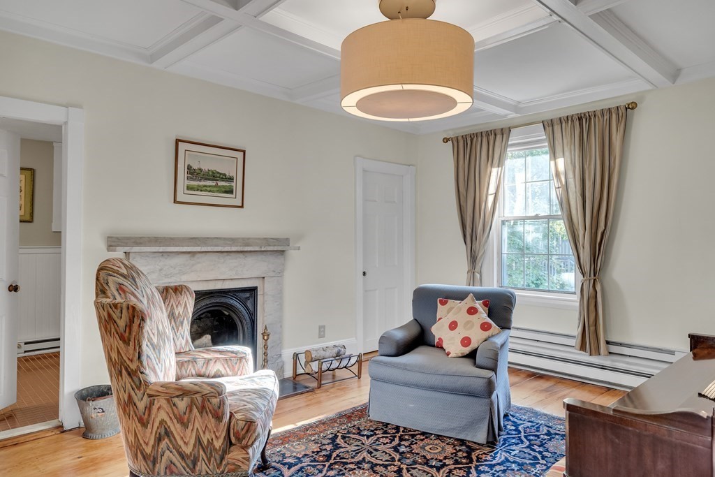 176 Pleasant Street Arlington, MA 02476 - Photo 18 of 41 a living room with furniture and a fireplace