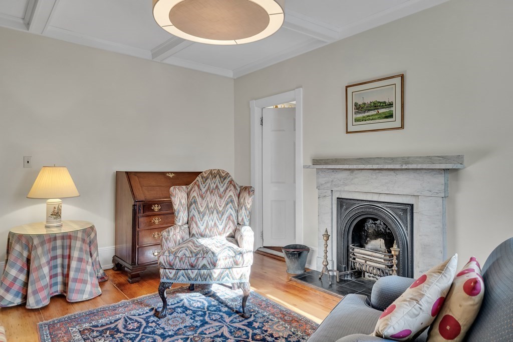 176 Pleasant Street Arlington, MA 02476 - Photo 19 of 41 a living room with furniture and a fireplace