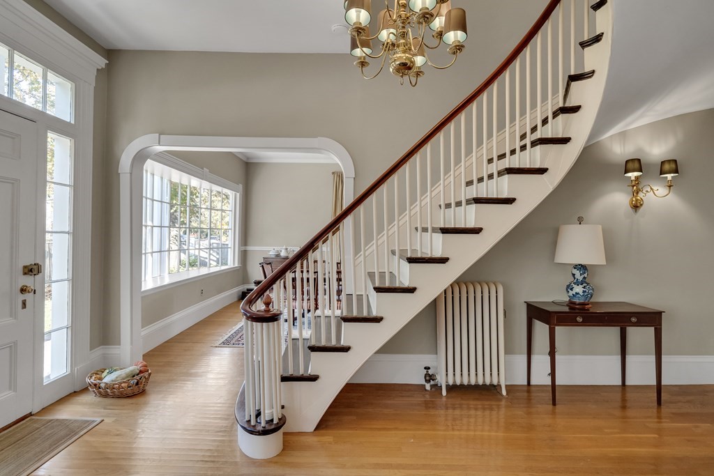 176 Pleasant Street Arlington, MA 02476 - Photo 2 of 41 a view of entryway and hall with wooden floor