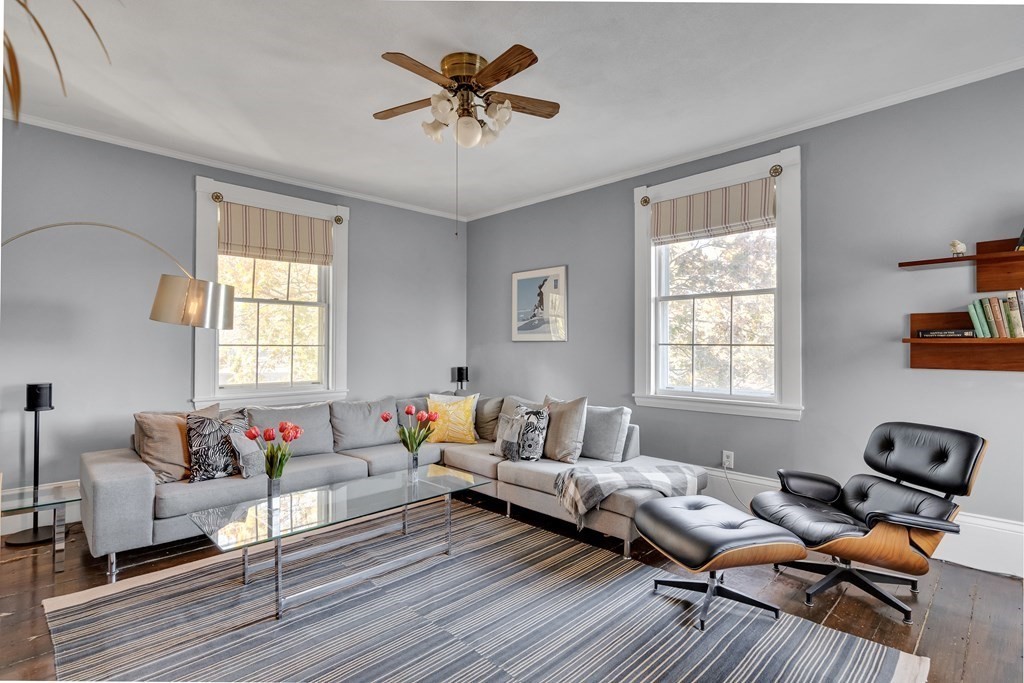 176 Pleasant Street Arlington, MA 02476 - Photo 21 of 41 a living room with furniture or couch and a window