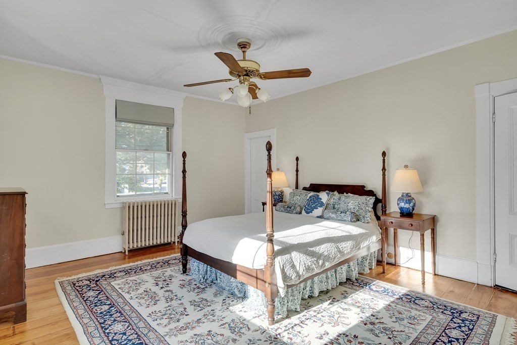 176 Pleasant Street Arlington, MA 02476 - Photo 24 of 41 a bedroom with a bed rug and window