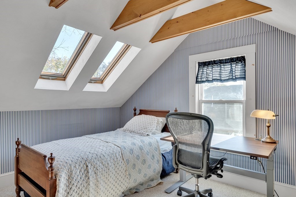 176 Pleasant Street Arlington, MA 02476 - Photo 30 of 41 a bedroom with a bed and window