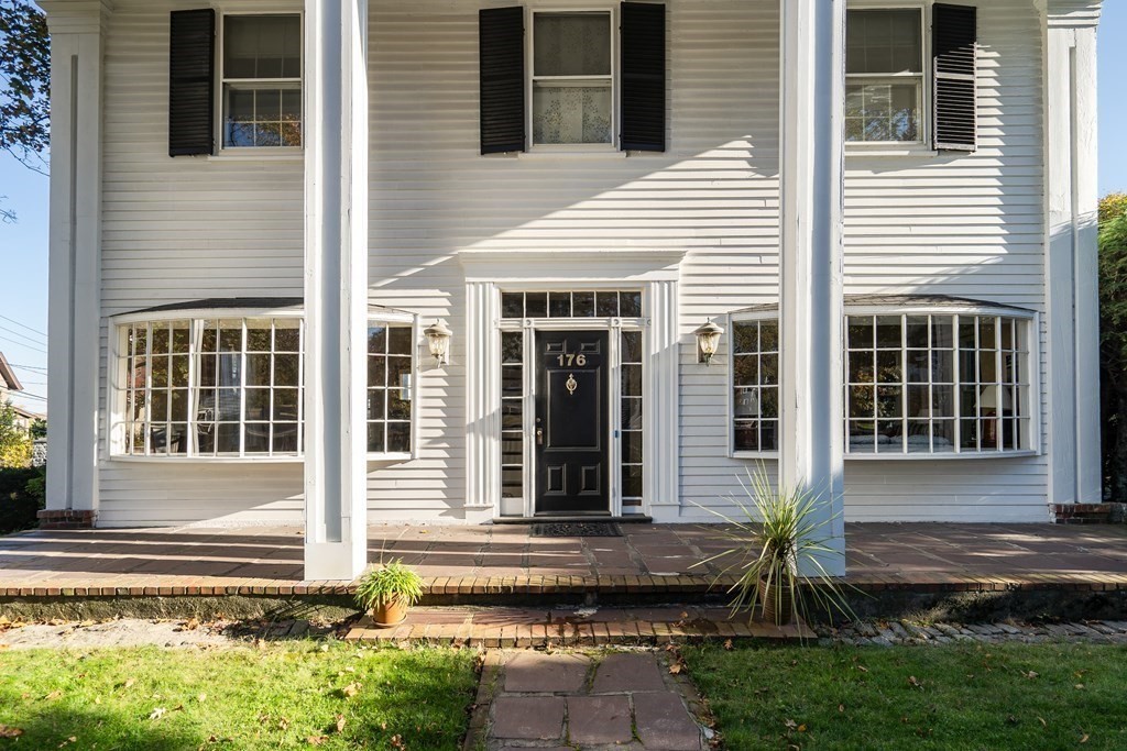 176 Pleasant Street Arlington, MA 02476 - Photo 32 of 41 a front view of a house with a yard