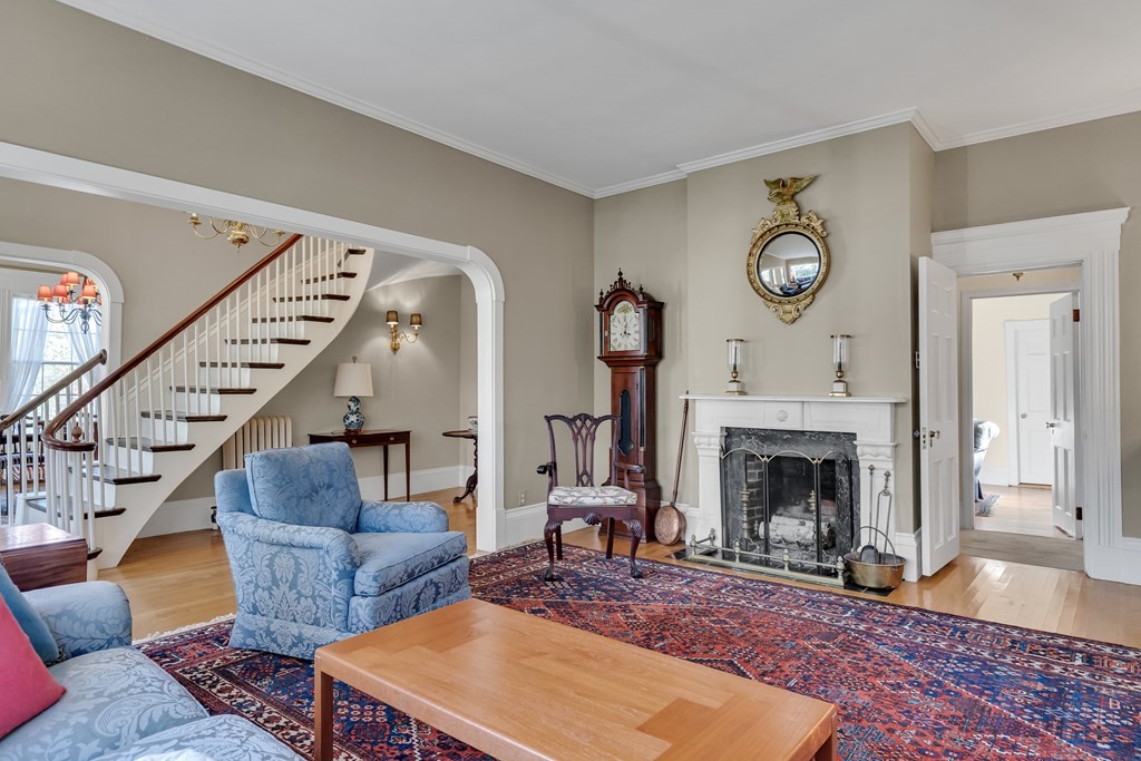 176 Pleasant Street Arlington, MA 02476 - Photo 5 of 41 a living room with furniture and a fireplace