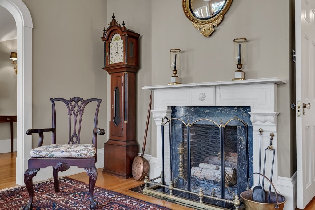 176 Pleasant Street Arlington, MA 02476 - Photo 7 of 41 a living room with furniture and a fireplace
