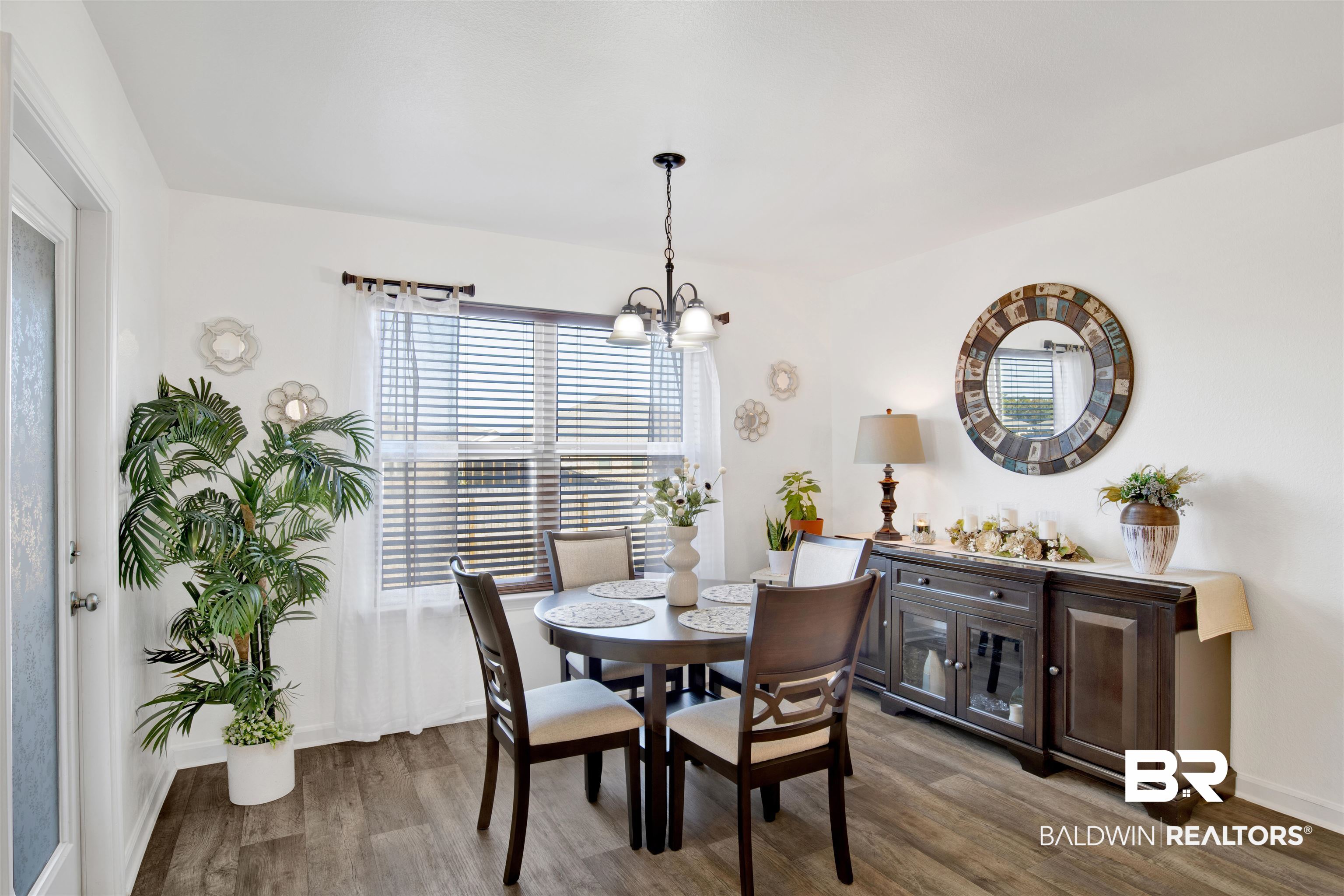 8102 Irwin Loop Daphne, AL 36526 - Photo 13 of 30 Dining area with wood-type flooring and a chandelier