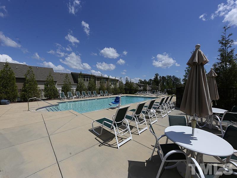 6414 Swatner Drive Raleigh, NC 27612 - Photo 16 of 21 a view of a patio with chairs and table in patio