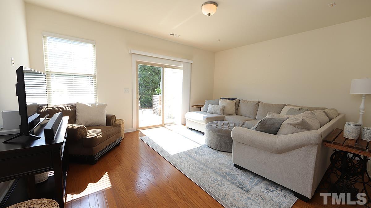 6414 Swatner Drive Raleigh, NC 27612 - Photo 6 of 21 a living room with furniture and a large window